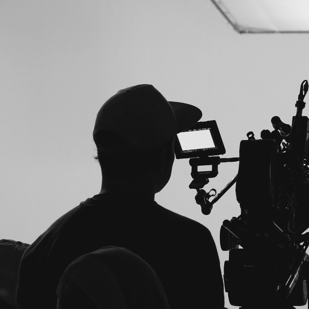 Silhouette holding camera